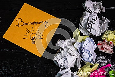 Writing brainstorming on memo post reminder. Text on sticky paper, crumpled paper Stock Photo