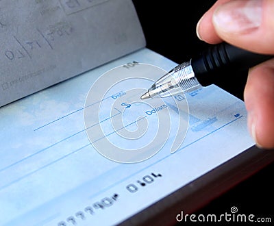 Writing a check Stock Photo