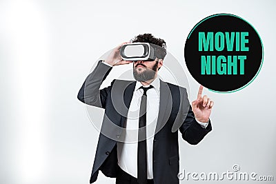 Writing displaying text Movie Night. Word for Casual informal reunion to watch movies at home Leisure date Stock Photo