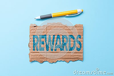 Writing displaying text Rewards. Word for Given in recognition of service effort achievement Prize Gift Simple Homemade Stock Photo