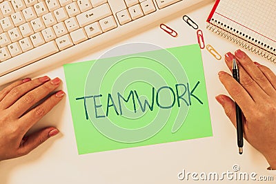 Writing displaying text Teamwork. Business overview the group s is collaborative effort to accomplish a common goal Stock Photo