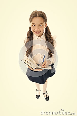Writing essay. Girl with copy book or workbook. Kid perfect student ready with homework. School girl excellent pupil Stock Photo
