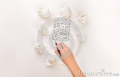 Writing hand in crumpled paper Stock Photo