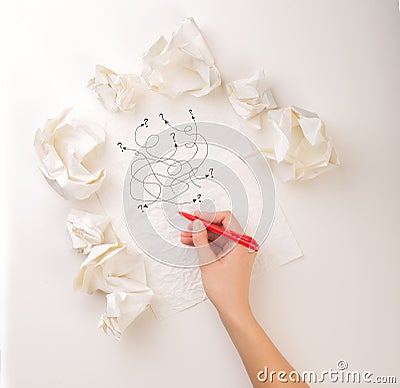 Writing hand in crumpled paper Stock Photo