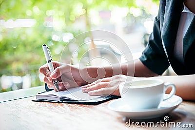 Writing a journal Stock Photo