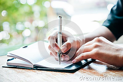 Writing a journal Stock Photo