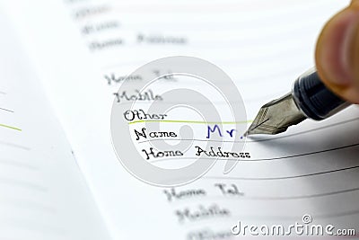 Writing the name on a paper with a pen using for concept of Namesake day Stock Photo