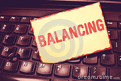 Writing note showing Balancing. Business photo showcasing put something in a steady position so that it does not fall Stock Photo