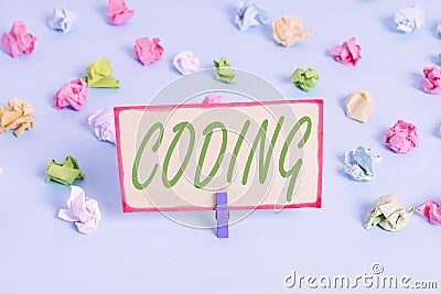 Writing note showing Coding. Business photo showcasing assigning code to something for classification identification Colored Stock Photo