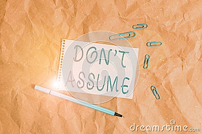 Writing note showing Don T Assume. Business photo showcasing do not accept something to be true without question or Stock Photo