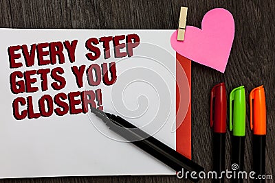 Writing note showing Every Step Gets You Closer. Business photo showcasing Keep moving to reach your goals objectives Bold red wor Stock Photo