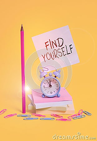 Writing note showing Find Yourself. Business photo showcasing To become selfsufficient and do things for yourself Alarm clock Stock Photo