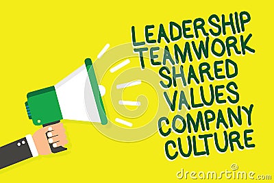 Writing note showing Leadership Teamwork Shared Values Company Culture. Business photo showcasing Group Team Success Man holding m Stock Photo