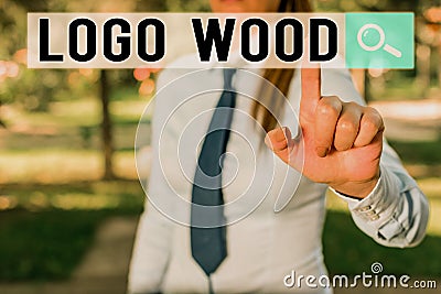 Writing note showing Logo Wood. Business photo showcasing Recognizable design or symbol of a company inscribed on wood Stock Photo