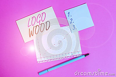 Writing note showing Logo Wood. Business photo showcasing Recognizable design or symbol of a company inscribed on wood Stock Photo