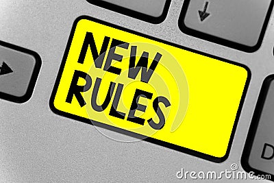 Writing note showing New Rules. Business photo showcasing A state of changing an iplemented policy for better upgrade Keyboard yel Stock Photo