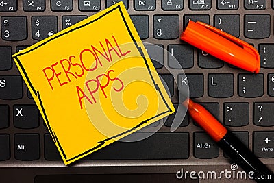 Writing note showing Personal Apps. Business photo showcasing Organizer Online Calendar Private Information Data Yellow paper keyb Stock Photo