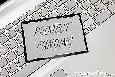 Writing note showing Project Funding. Business photo showcasing paying for start up in order make it bigger an Stock Photo