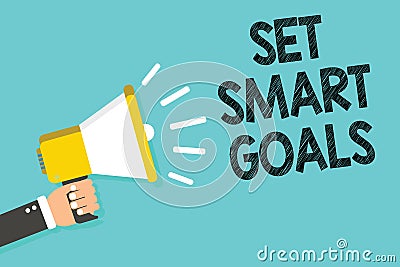 Writing note showing Set Smart Goals. Business photo showcasing Establish achievable objectives Make good business plans Man holdi Stock Photo