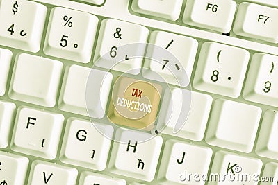 Writing note showing Tax Deductions. Business photo showcasing an amount or cost that subtracted from someone s is income White pc Stock Photo