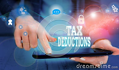 Writing note showing Tax Deductions. Business photo showcasing an amount or cost that subtracted from someone s is income Picture Stock Photo