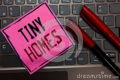 Writing note showing Tiny Homes. Business photo showcasing houses contain one room only or two and small entrance Cheap Pink paper Stock Photo