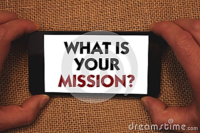 Writing note showing What Is Your Mission Question. Business photo showcasing Positive goal focusing on achieving success Man hol Stock Photo