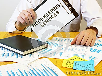 Writing note shows the text bookkeeping services Stock Photo