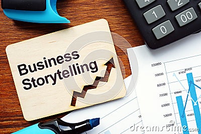 Writing note shows the text Business Storytelling Stock Photo