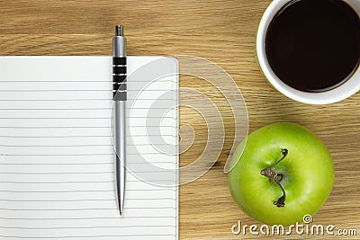 Writing paper and ballpoint-pen on wooden desk Stock Photo