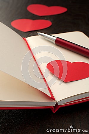 Writing romantic poem or text in notebook Stock Photo