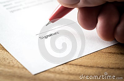 Writing signature. Man signing settlement, contract or agreement for employment and hiring. Stock Photo