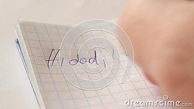 Writing text with a pen in a notebook. A guy writes with a pen in a notebook a letter : Hi dad, I gay .. after writing, he crosses out what was written. Extreme Writing text with a pen in a notebook. A guy writes with a pen in a notebook a letter : Hi dad, I gay .. after writing, he crosses out what was written. Extreme