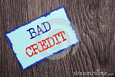 Writing text showing Bad Credit. Business photo showcasing Poor Bank Rating Score For Loan Finance written on Blue Sticky Note Pa Stock Photo