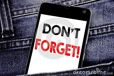 Writing text showing Do Not Forget. Business concept for Reminder Message written mobile cell phone with copy space in the back pa Stock Photo