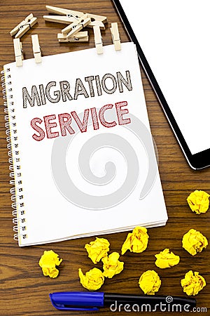 Writing text showing Migration Service. Business concept for Online Network Idea written on note paper with folded Meaning Thinkin Stock Photo