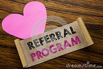 Writing text showing Referral Program. Business concept for Refer Marketing written on sticky note paper, wooden wood background. Stock Photo