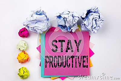 Writing text showing Stay Productive written on sticky note in office with paper balls. Business concept for Concentration E Stock Photo