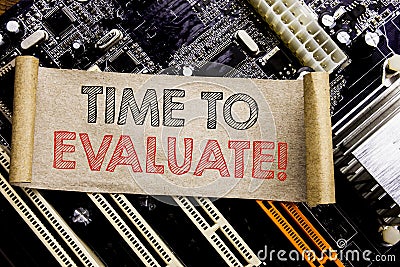 Writing text showing Time To Evaluate. Business concept for Assessment Evaluation Written on sticky note, computer main board back Stock Photo