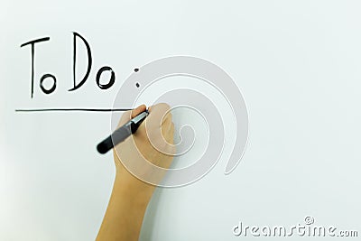 Writing todo onto a writing board Stock Photo