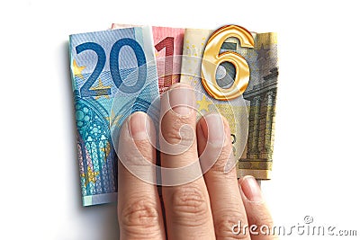 2016 written with euros bank notes in a hand isolated on white Stock Photo