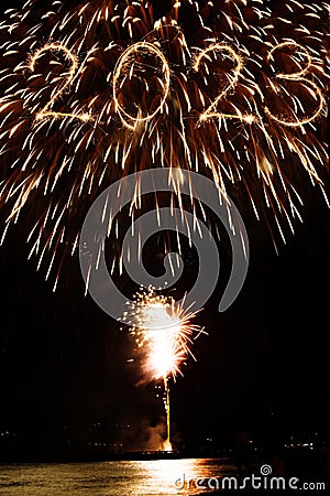 2023 new year coming written with sparkler and fireworks illuminationas a background Stock Photo