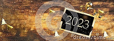 2023 written on little board on wooden background Stock Photo