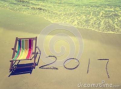 2017 written in sand write on tropical beach. Stock Photo