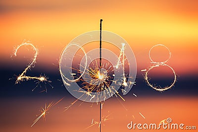 2018 written with Sparkle firework on sunset background, happy n Stock Photo