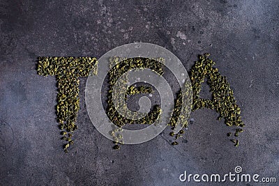 Written tea on a black background. Stock Photo