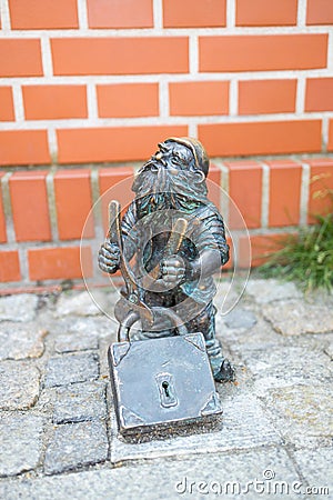 Wroclaw Dwarf. The small figurines in the streets of Wroclaw old town. Hunting for dwarfs, tourist attraction Editorial Stock Photo