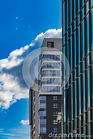 Perspective view to facades of modern corporate building with glass facade with high skyscraper Editorial Stock Photo