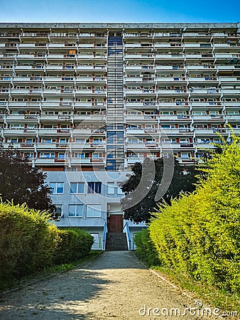 Symmetrical look to residential building with small park in front of Editorial Stock Photo