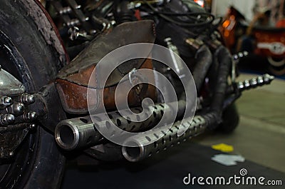 WROCLAW, POLAND - August 11, 2019: USA cars show: close-up of a old vintage silver colored motorcycle engine exhaust Editorial Stock Photo